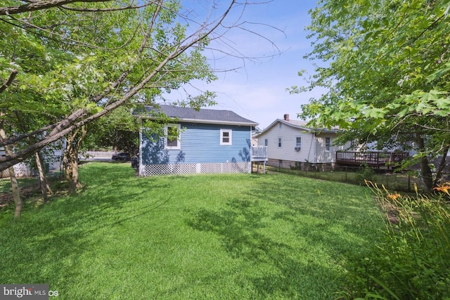 rear view of house with a lawn