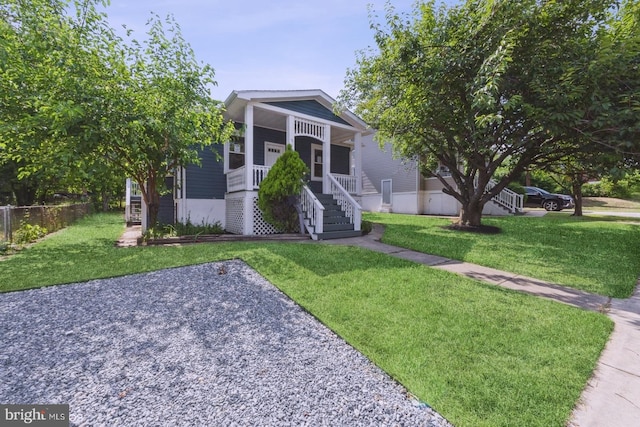 view of front of property with a porch and a front yard