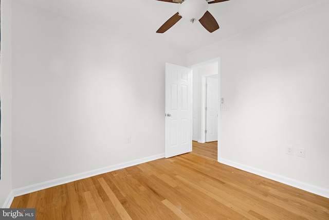 empty room featuring hardwood / wood-style floors and ceiling fan