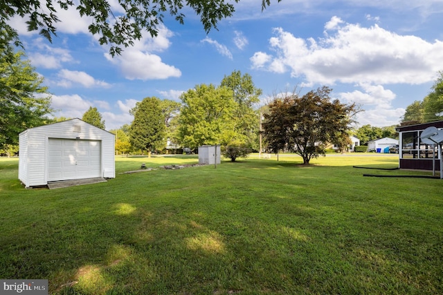 view of yard with a storage shed and a garage