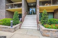 entrance to property with a balcony