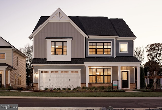 view of front of property featuring a garage