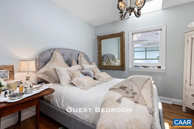 bedroom with hardwood / wood-style floors and a notable chandelier