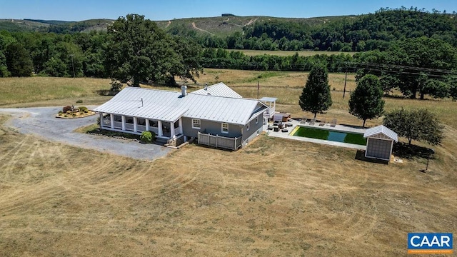 drone / aerial view featuring a mountain view and a rural view