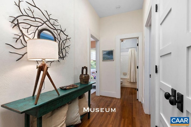 hall with dark hardwood / wood-style floors