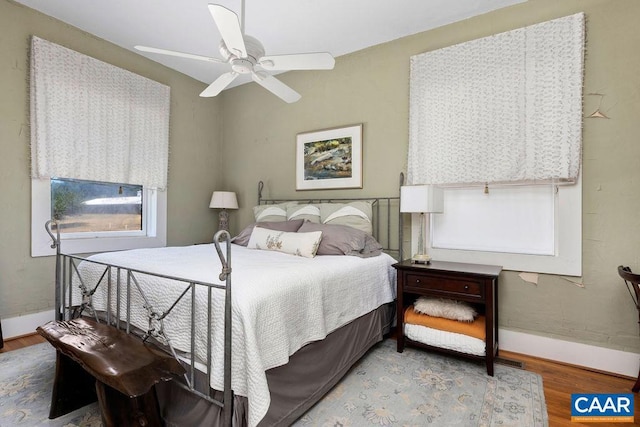 bedroom featuring ceiling fan and hardwood / wood-style flooring