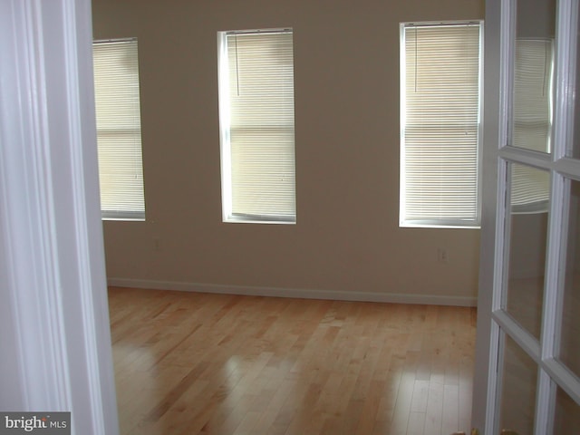 spare room featuring light hardwood / wood-style flooring