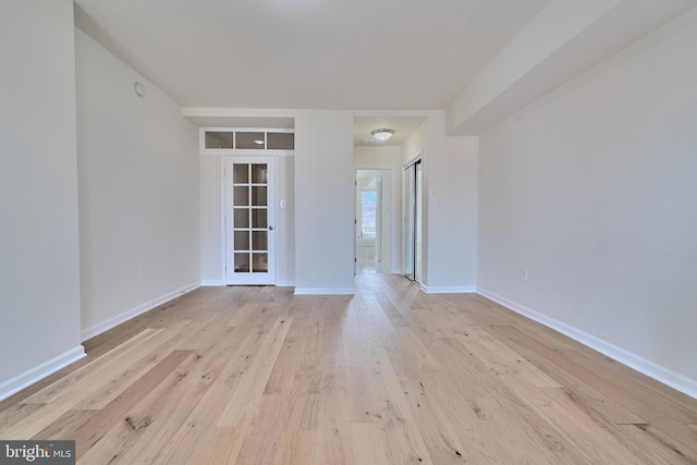 spare room with light hardwood / wood-style flooring