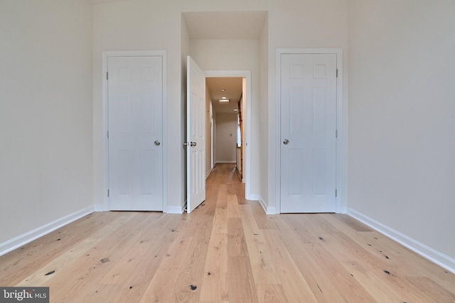 unfurnished bedroom with light wood-type flooring