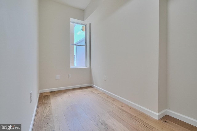 spare room featuring light wood-type flooring