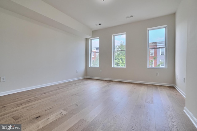 spare room featuring light hardwood / wood-style flooring