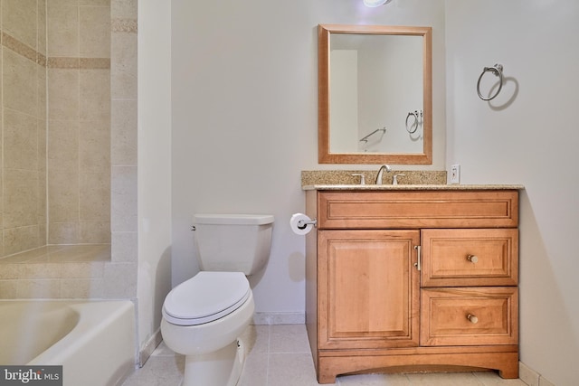 bathroom featuring tile patterned floors, toilet, and vanity