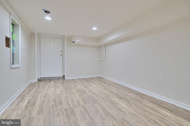 empty room with light hardwood / wood-style flooring