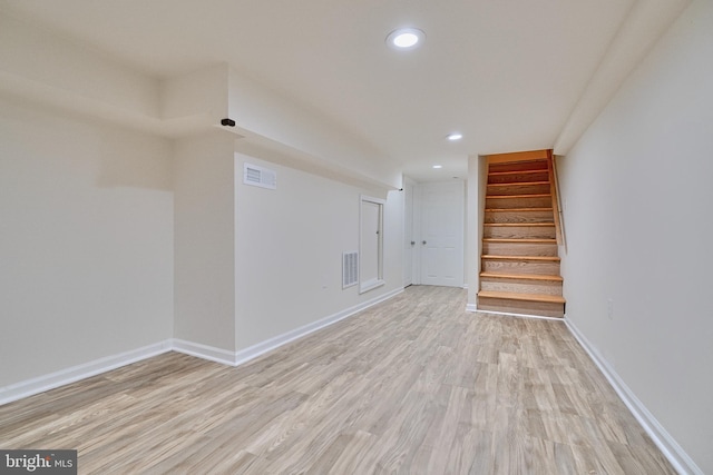 basement featuring light hardwood / wood-style floors