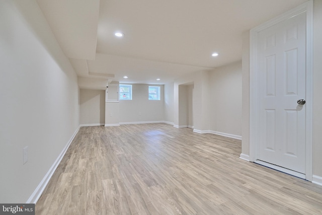 basement featuring light hardwood / wood-style floors