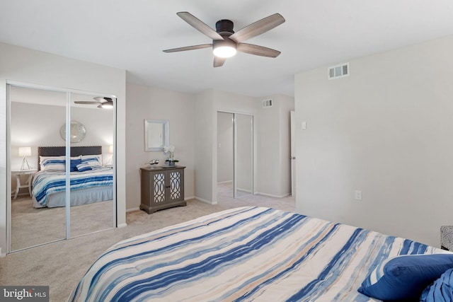 bedroom featuring light colored carpet and ceiling fan