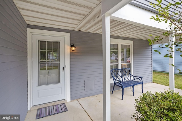 property entrance featuring covered porch