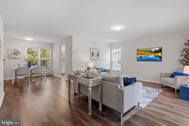 living room with hardwood / wood-style floors and a healthy amount of sunlight