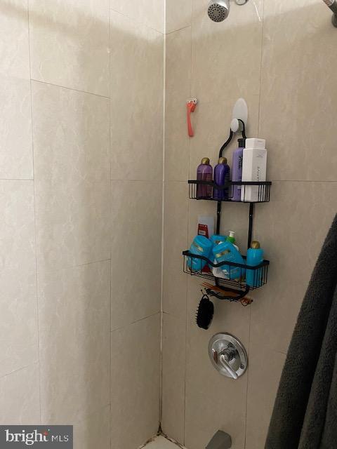 room details with a tile shower