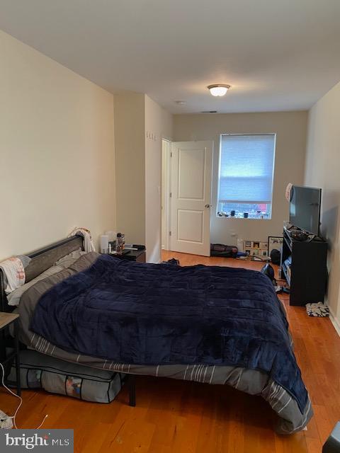 bedroom featuring hardwood / wood-style floors