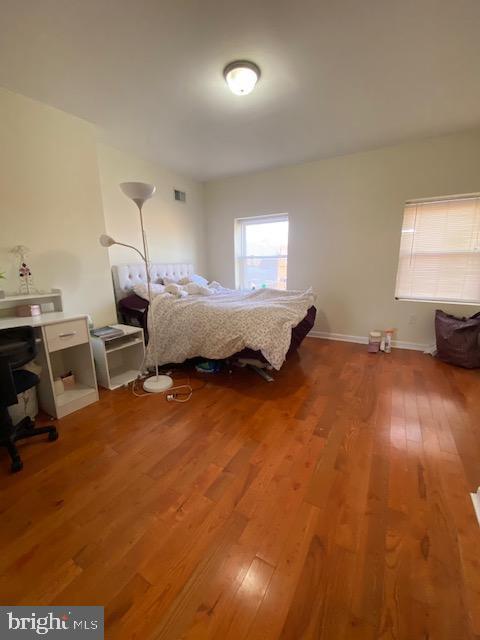 unfurnished bedroom featuring hardwood / wood-style floors