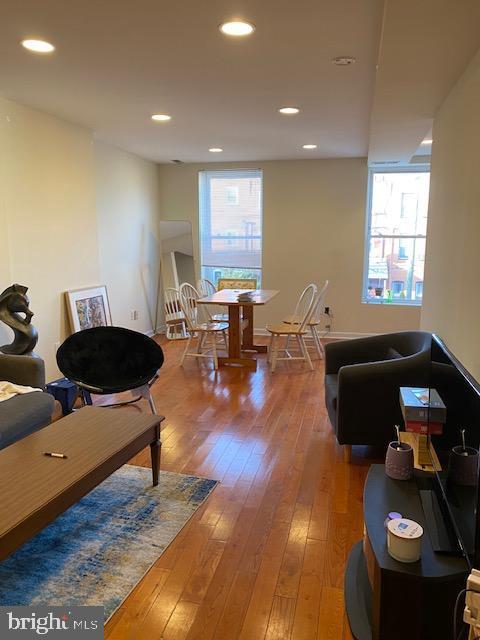 living room featuring wood finished floors and recessed lighting