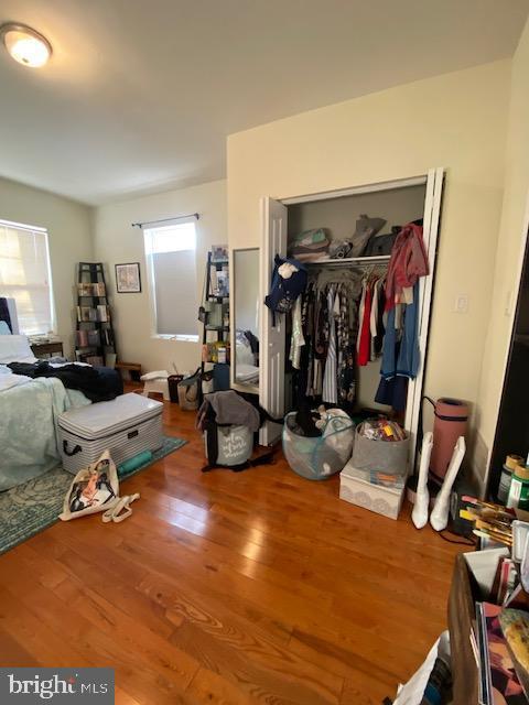 bedroom featuring a closet and wood finished floors