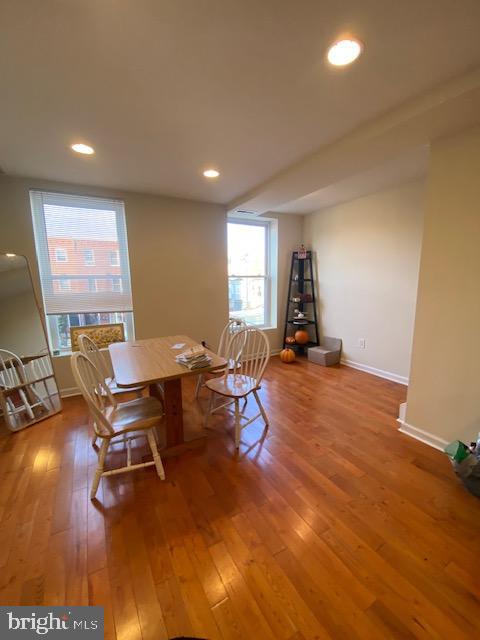 dining room with wood-type flooring