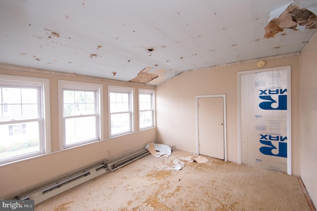 empty room featuring lofted ceiling