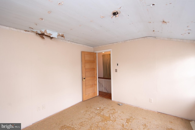 empty room with vaulted ceiling