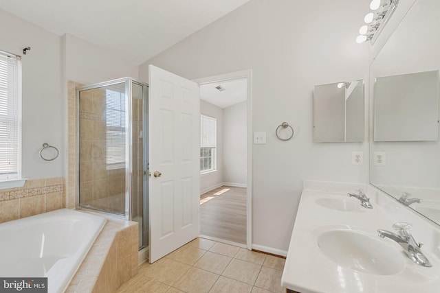 bathroom featuring separate shower and tub, vanity, tile patterned flooring, and lofted ceiling