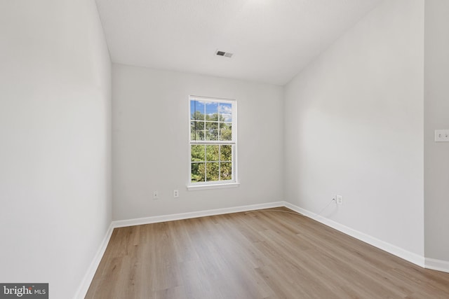 unfurnished room featuring light wood-type flooring