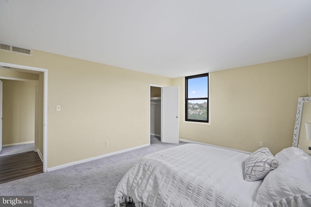 carpeted bedroom with a closet