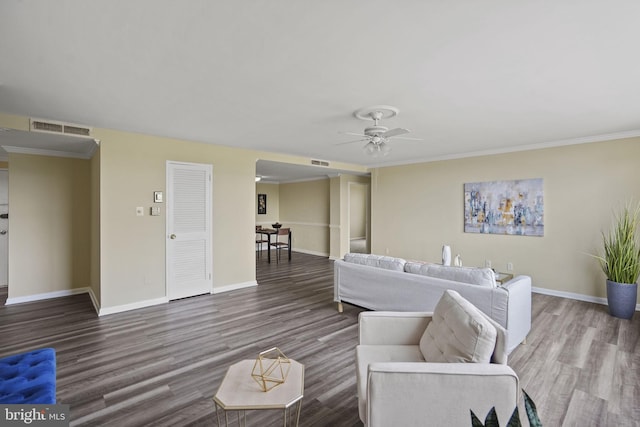 living room with ceiling fan, crown molding, and hardwood / wood-style floors