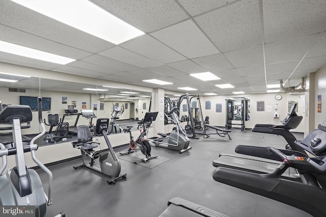 workout area with a paneled ceiling