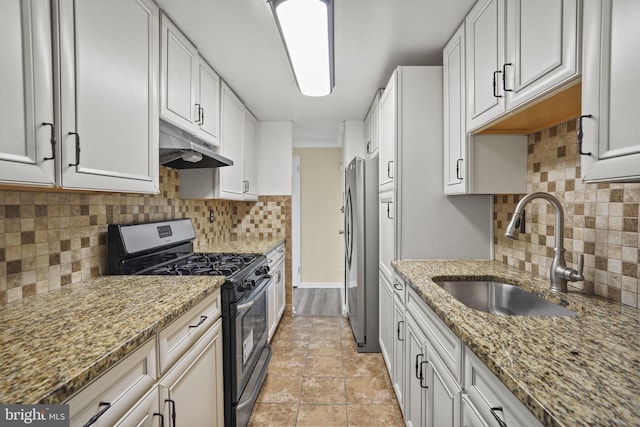 kitchen featuring white cabinets, appliances with stainless steel finishes, and sink