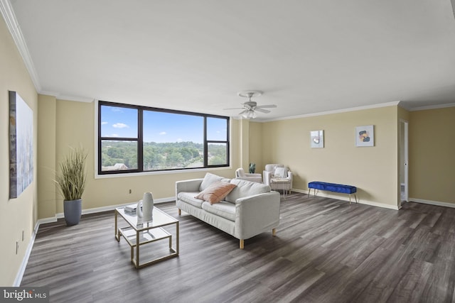 living room featuring ceiling fan, dark hardwood / wood-style floors, and crown molding