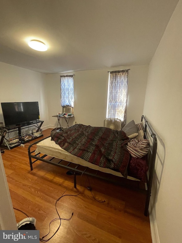 bedroom with wood-type flooring