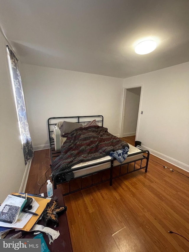 bedroom featuring hardwood / wood-style floors