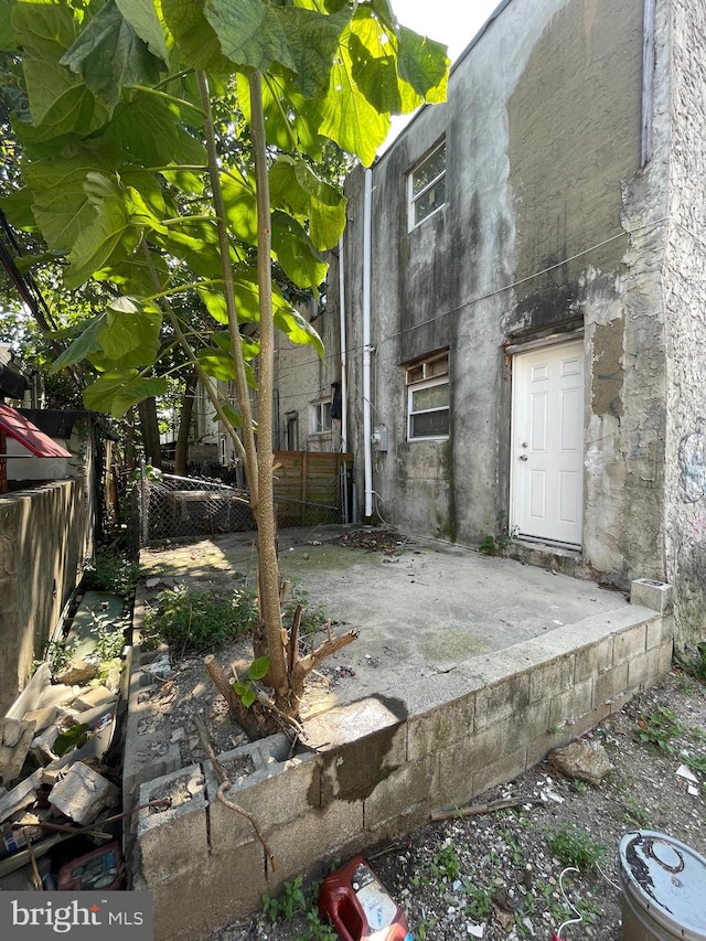 view of side of home with a patio area