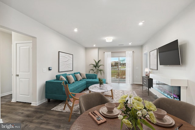 living room featuring dark wood-type flooring