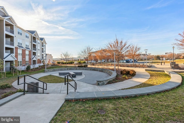 view of property's community with a lawn