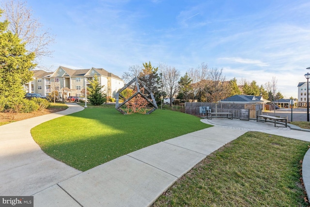 view of home's community with a yard