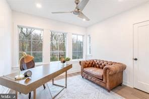 home office featuring ceiling fan and light wood-type flooring