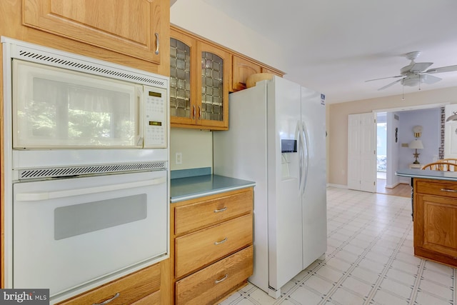 kitchen with ceiling fan and white appliances