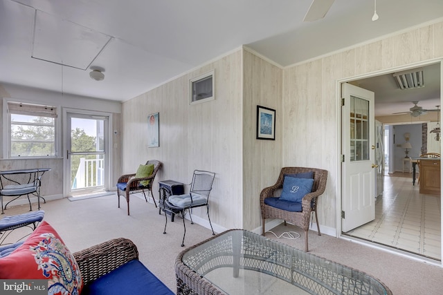 living room featuring light carpet and ceiling fan