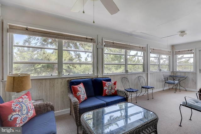 sunroom / solarium with plenty of natural light and ceiling fan