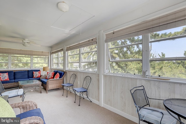 sunroom / solarium featuring ceiling fan