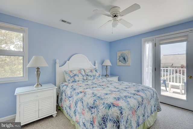 bedroom featuring light colored carpet, access to exterior, and ceiling fan