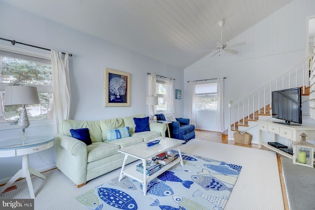 living room with ceiling fan, light hardwood / wood-style floors, vaulted ceiling, and wooden ceiling